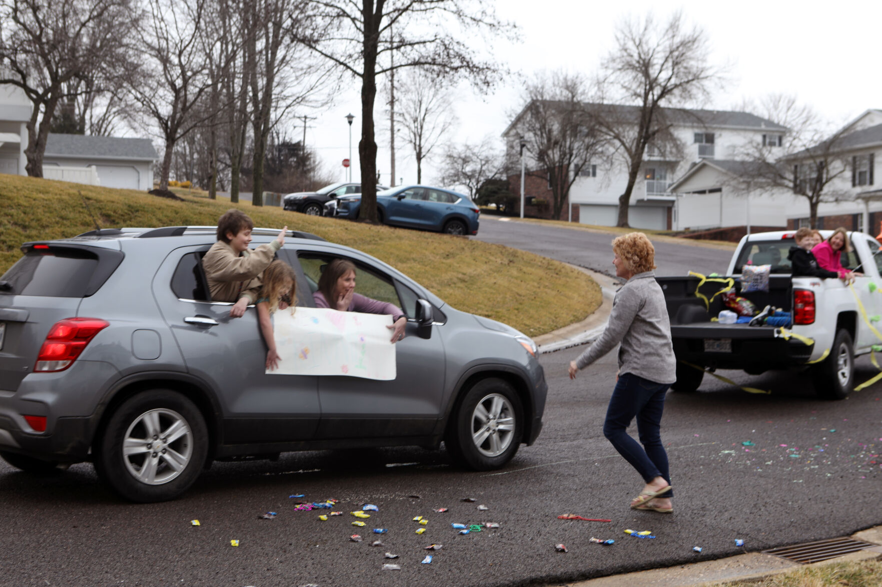 People greet Kim Strubberg during a parade